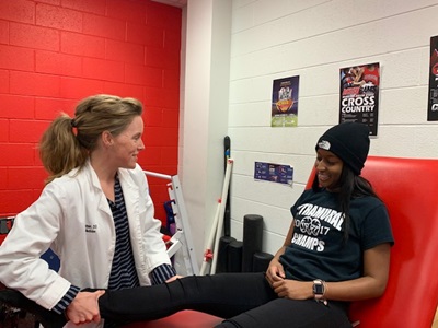 Laura Lintner, DO assisting a patient at WSSU.