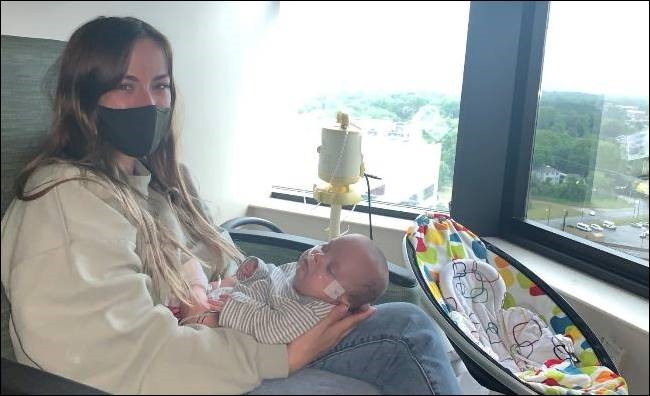 Jessica's last time holding River in the NICU before he was discharged to go home.