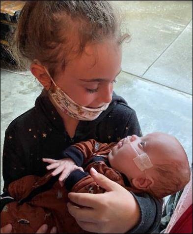 River meeting one of his big sisters, Ridgley.