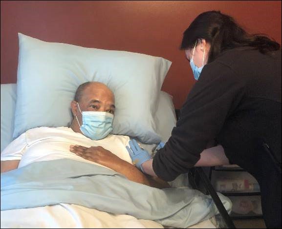 74-year-old Robert Hook of Winston-Salem received his first dose of the COVID vaccine on Feb. 11, 2021 from Christine Barthen, Pharm.D., community pharmacy resident at Wake Forest Baptist Health.