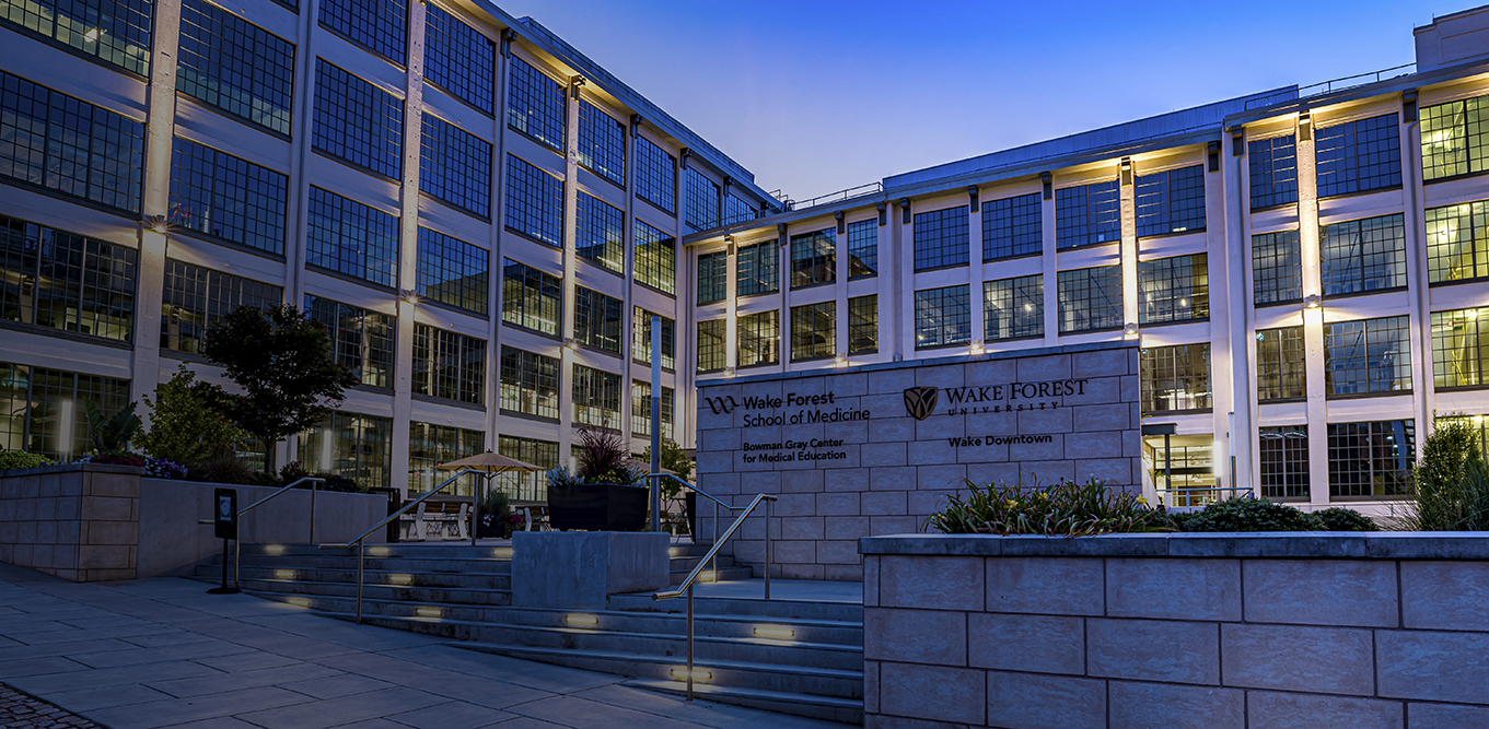 Wake Forest School of Medicine's Bowman Gray Center for Medical Education courtyard at dusk