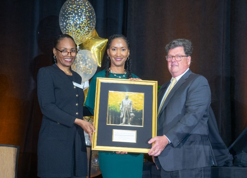 Photo of Dr. Turner receiving an award at Alumni Weekend 2023 at Wake Forest University School of Medicine.