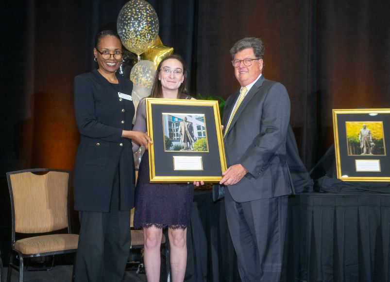 Woman named Collette receiving an award at Alumni Weekend 2023 at Wake Forest University School of Medicine.