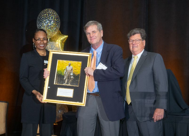 Photo of Dr. Ohl receiving an award at Alumni Weekend 2023 at Wake Forest University School of Medicine.