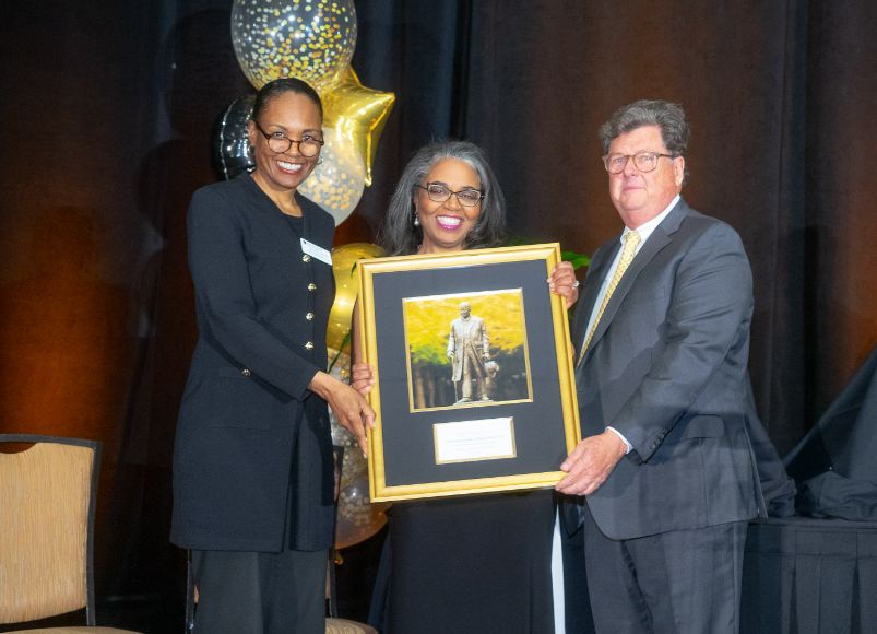 Photo of Dr. McMichael receiving an award at Alumni Weekend 2023 at Wake Forest University School of Medicine.