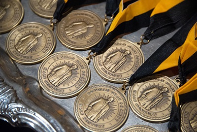 Medallions struck with image of Bowman Gray hang on ribbons of gold and black