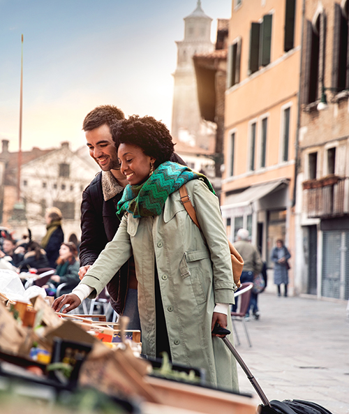 Hispanic brazilian couple enjoying an holiday vacation in Venice, Italy