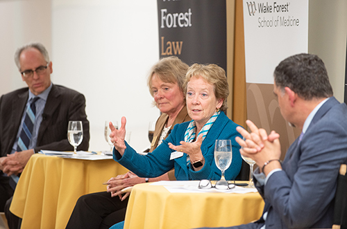 Julie Ann Freischlag, dean of Wake Forest School of Medicine, gestures as she speaks at a gathering of alumni of the Wake Forest schools of Business, Law and Medicine