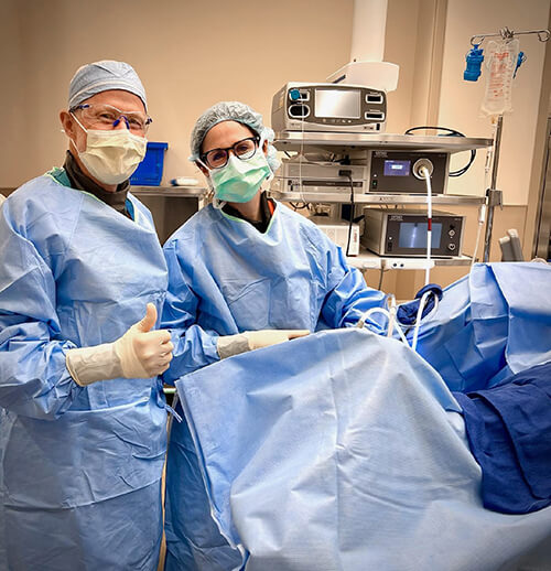 Two medical professionals in a medical setting.