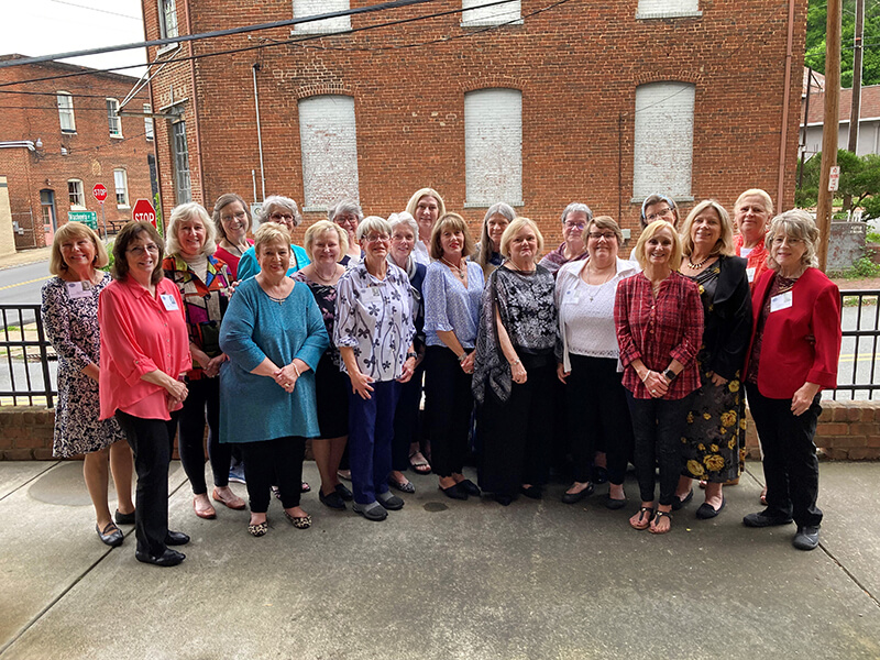 A group of people smiling at the camera.