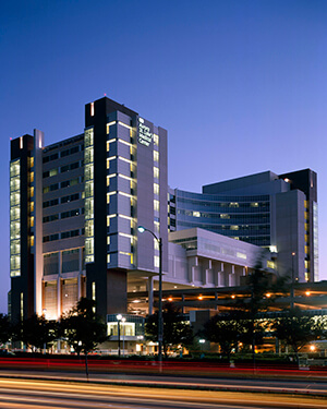 A medical office tower at night.