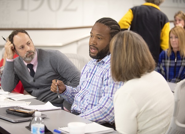 Alumni engage in discussion during class at Bowman Gray Center for Medical Education