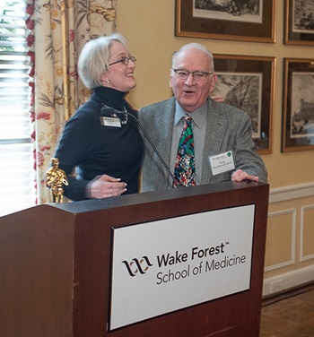 Lynn Anthonyy, MD, House Staff '01, presents the Emeritus Academy Award to C. Douglas Maynard, MD '59