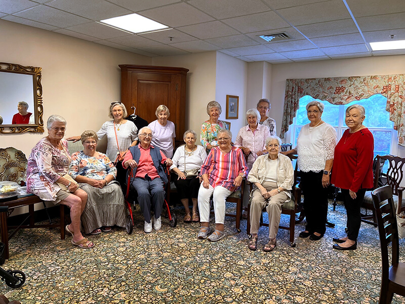 A group of women at a 60th class reunion.