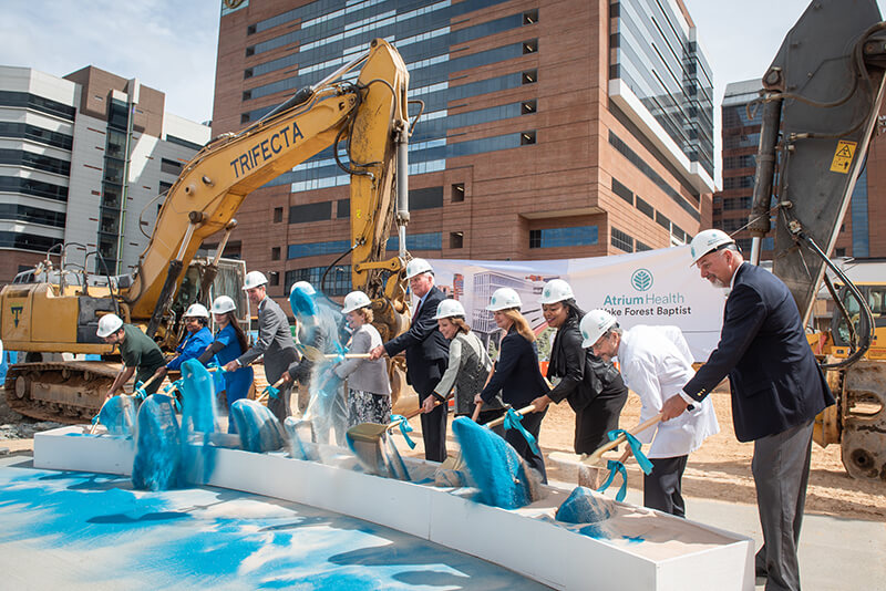 A group of people at a groundbreaking ceremony.