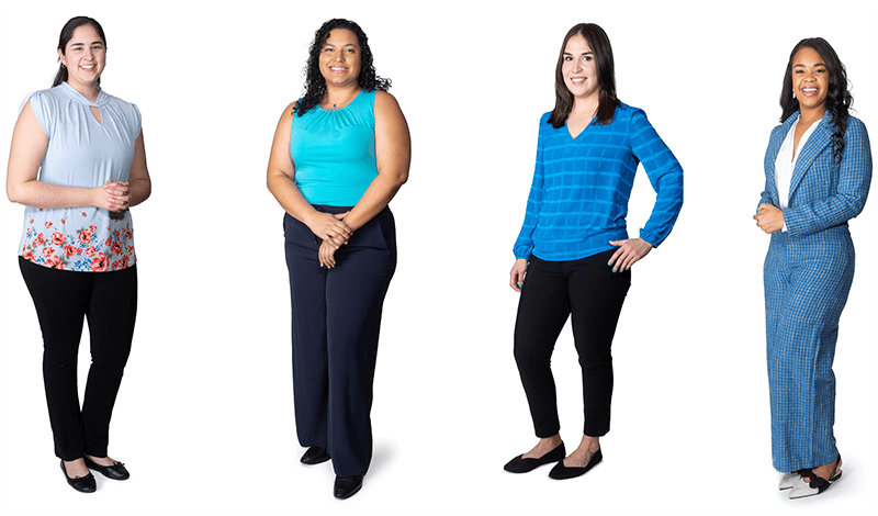 Three people standing in a row.