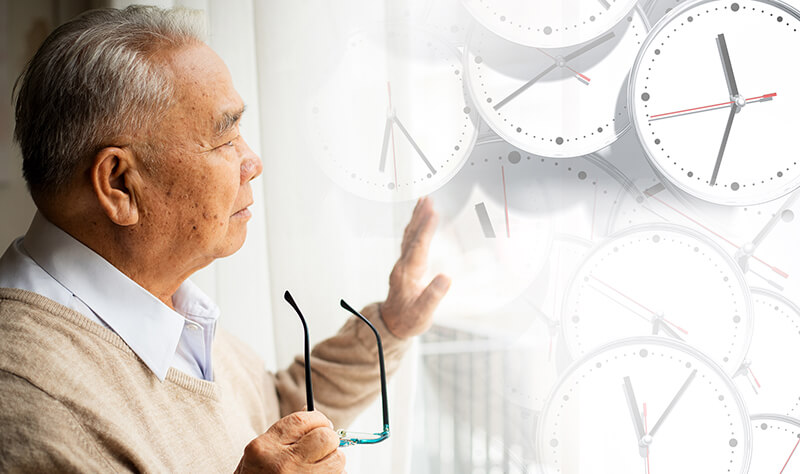 A person looking at graphics of clocks.