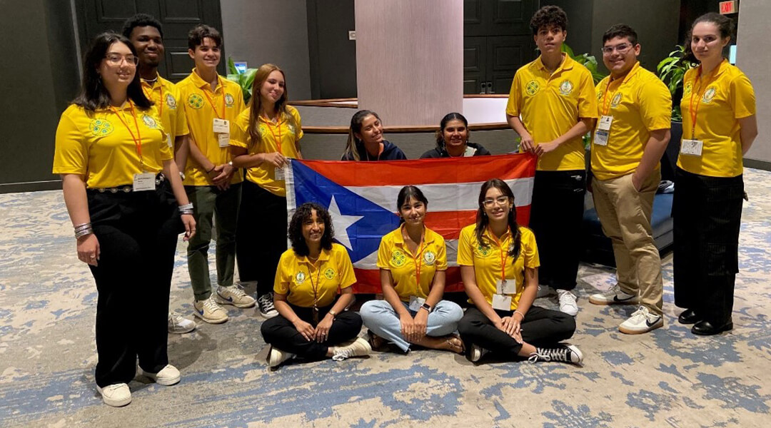 STEPUP group photograph in front of Puerto Rican flag