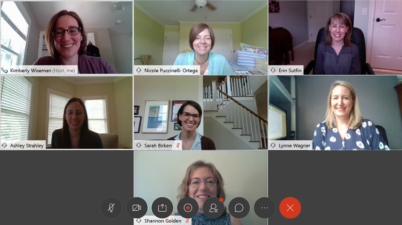 Computer screen with seven women in boxes during a video meeting