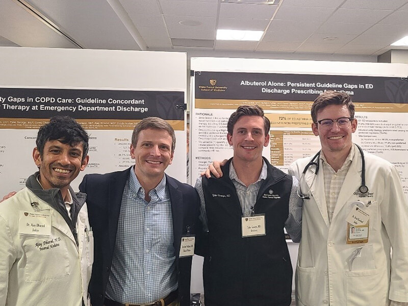 Ajay Dharod, MD; Christian Pulliam, DO; Tyler George, MD; and Bradley Rowland, MD at the Atrium Health Wake Forest Baptist Internal Medicine Research Symposium, May 13, 2026.