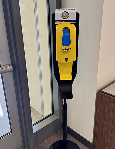 A sunscreen dispenser on the first floor of the Bowman Gray Center for Medical Education.