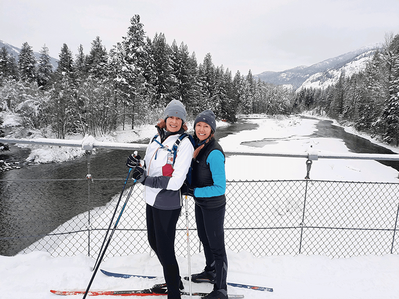 Laura Baker and another woman skiing.