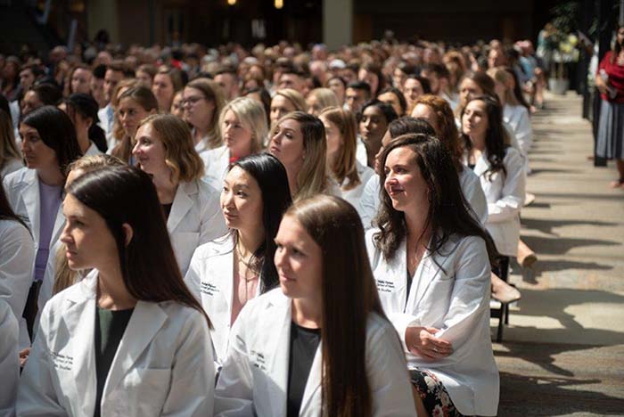 Wake PA Class of 2021 sits in chairs, listening to Pat Ober, MD