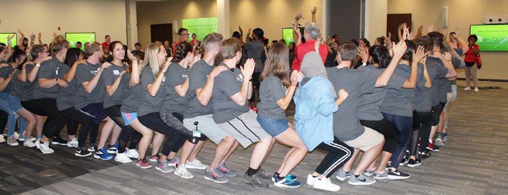 Wake PA Class of 2021 members get to know each other by sitting on each other's knees in a circle