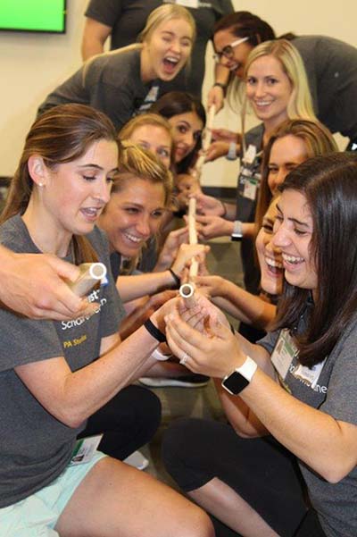 Wake PA Class of 2021 members play icebreaker game involving constructing a long tube