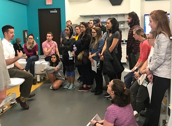 Students listen as faculty member discusses ultrasound technology