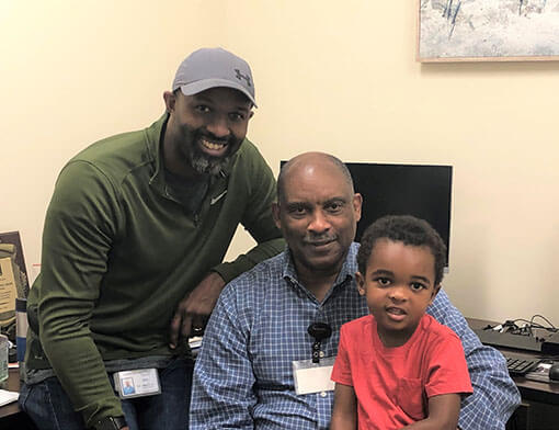 Members of the Wooten family posing for a group photo in casual attire.