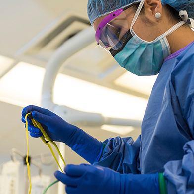 Doctor using tools in operating room. 