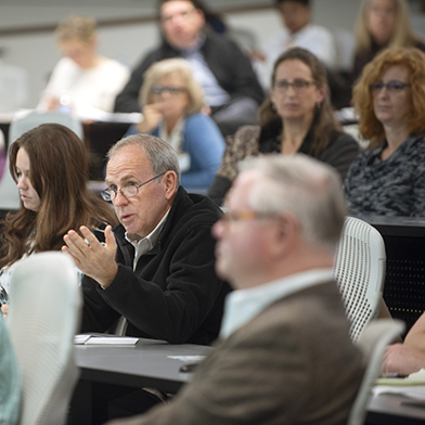 Adult learners engage in lecture discussion