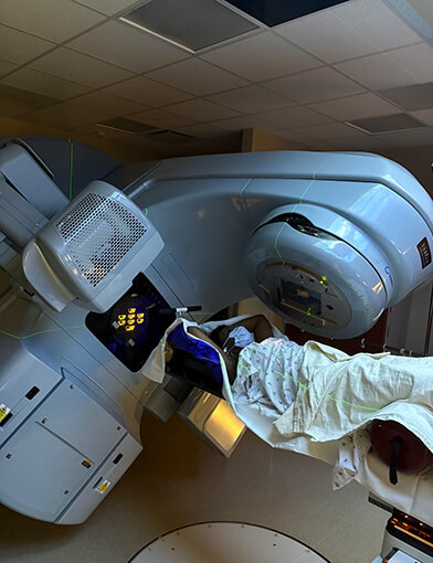 A woman undergoing diagnostic testing and scanning.