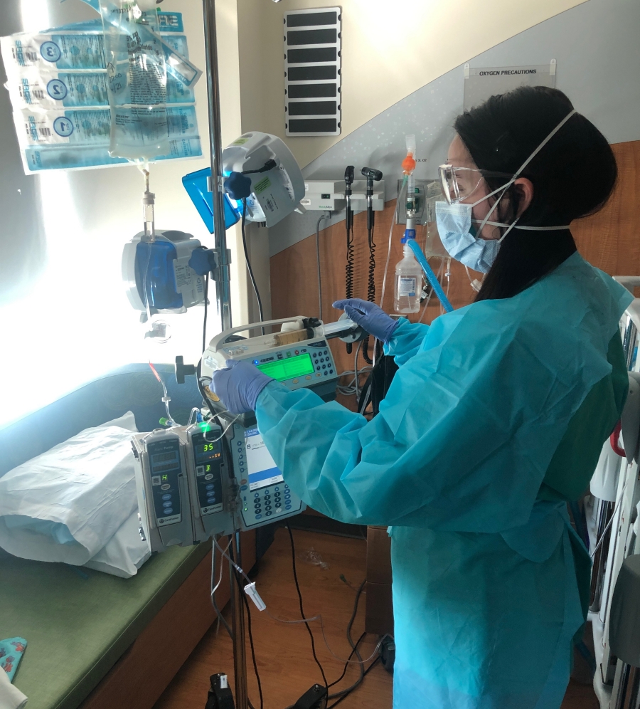 Austin Lane administering medication to a patient.  