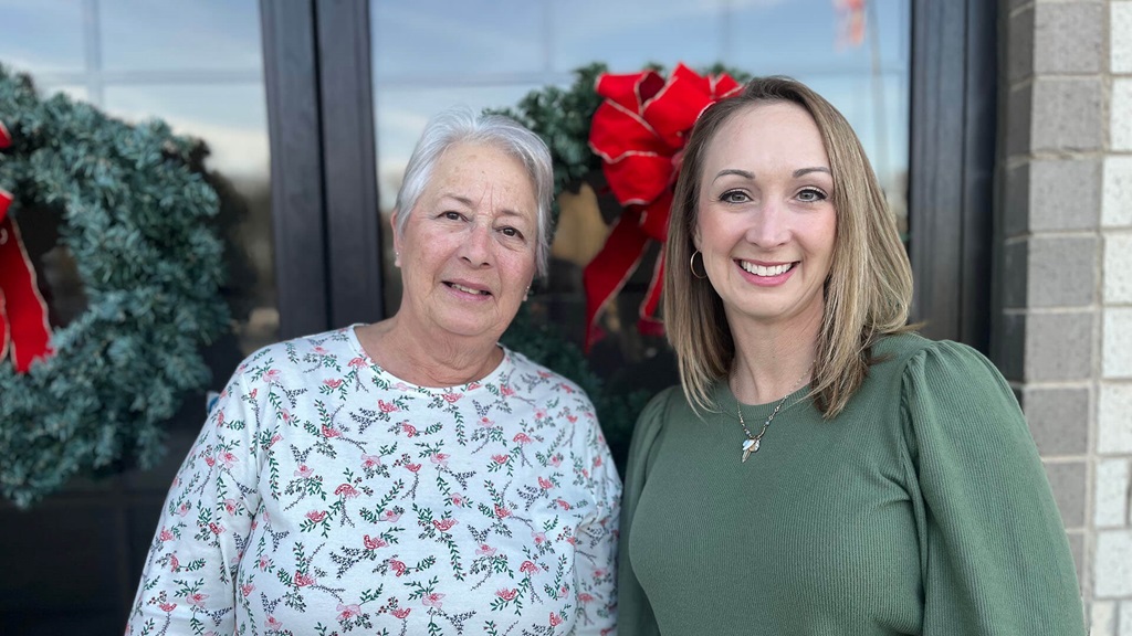 Carey McPeek and Terri Lemon standing next to one another smiling.