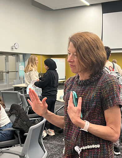 Dr. Michele Birch in a classroom taking to students.
