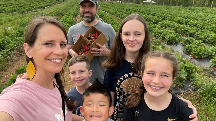 Dr. Renfrow and family on a strawberry picking trip