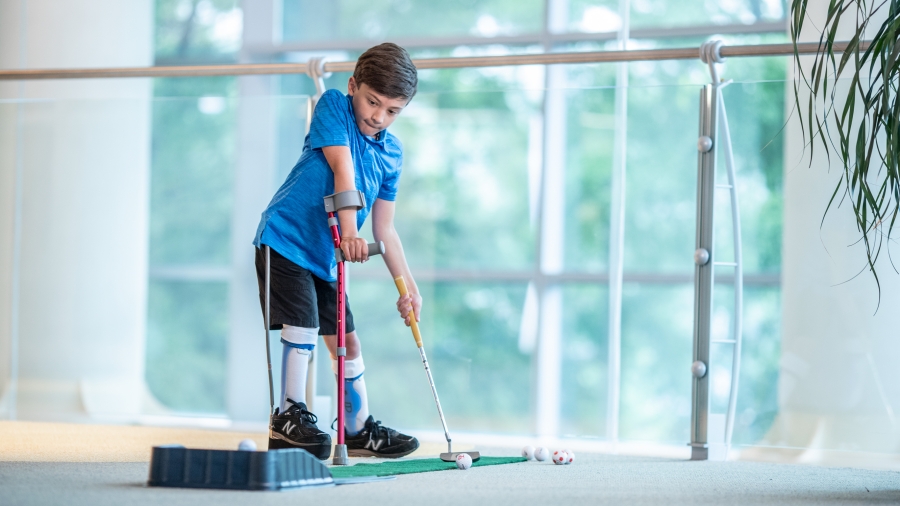 Born with spina bifida, Joshua faces gastroenterological challenges unique to his condition. But with the right care and support, he’s able to do things his way – including playing golf.  