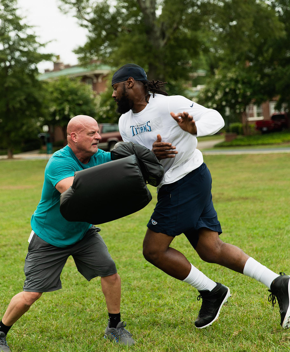 Denico Autry, defensive end for the Tennessee Titans, and Scott Brone, physical therapist and director of rehabilitation, work out during a rehabilitation session at the YMCA.