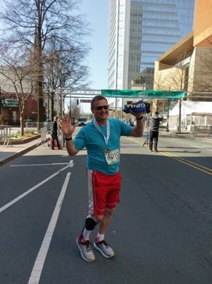 Man celebrates race completion.
