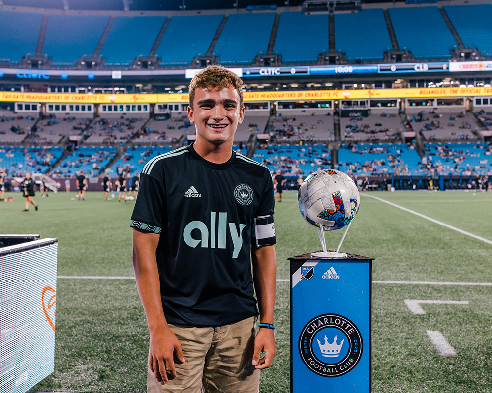 Ryan Wlodyka, 13-year-old Atrium Health Levine Children's patient, serves as the honorary captain for a Charlotte Football Club game.
