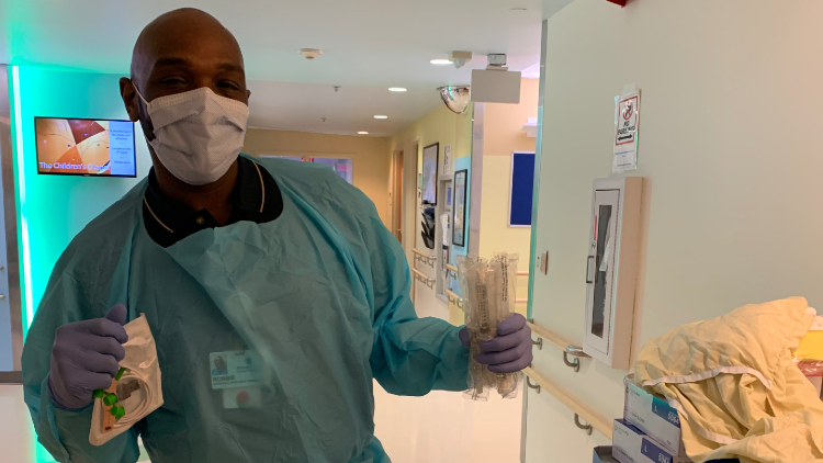  Robbie, the new materials resource manager, in the hallway of Levine Children's Hospital