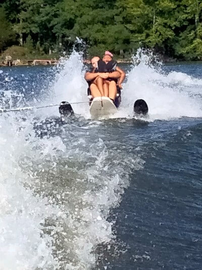 Ms. Harper water skiing with instructor.