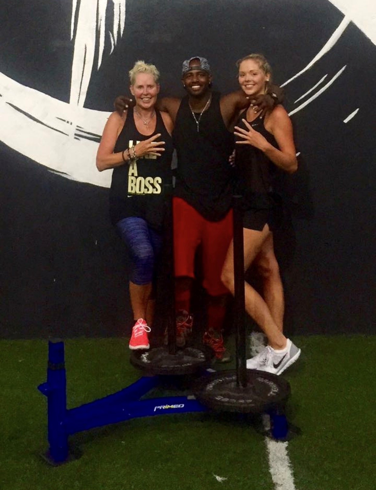 woman, daughter and trainer at gym