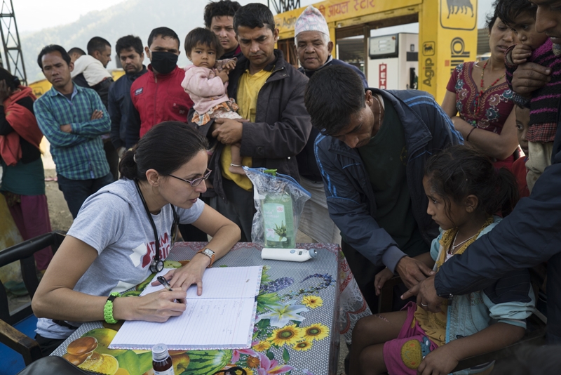 Carolinas Medical Centery-Mercy emergency physician Sapana Adhikari, left, logs notes on dozens of patients seeking care outside Kathmandu. Team Rubicon continues to identify outlying areas impacted by the quake that have yet to receive aid. 