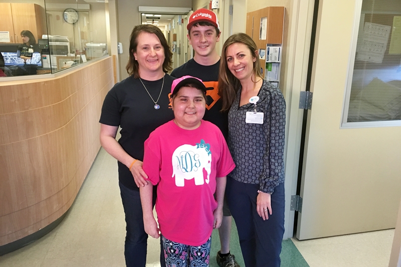 The DeBruhl Family (Monica, left, Ryland Madie) recently visited her social worker at Levine Children's Hospital, Kristine Pelletier-Garcia, at a recent checkup. Rylan donated his bone marrow to his sister that helped her battle a rare form of leukemia. Monica says Rylan is her daughter's hero. 
