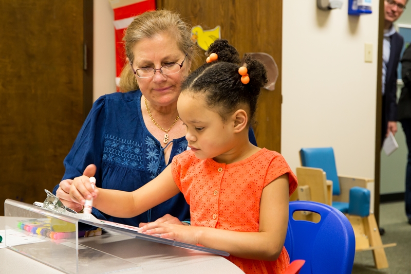 Tina Collop, an occupational therapist with Pediatric Therapy Pineville, part of Carolinas Rehabilitation, works with Ivanka on fine motor skills for functional hand use/grasp, visual motor integration and attention to task. 