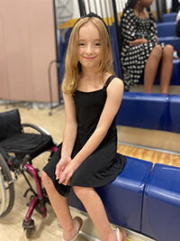 A child smiling at the camera.