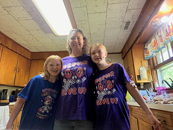 Three people smiling at the camera.